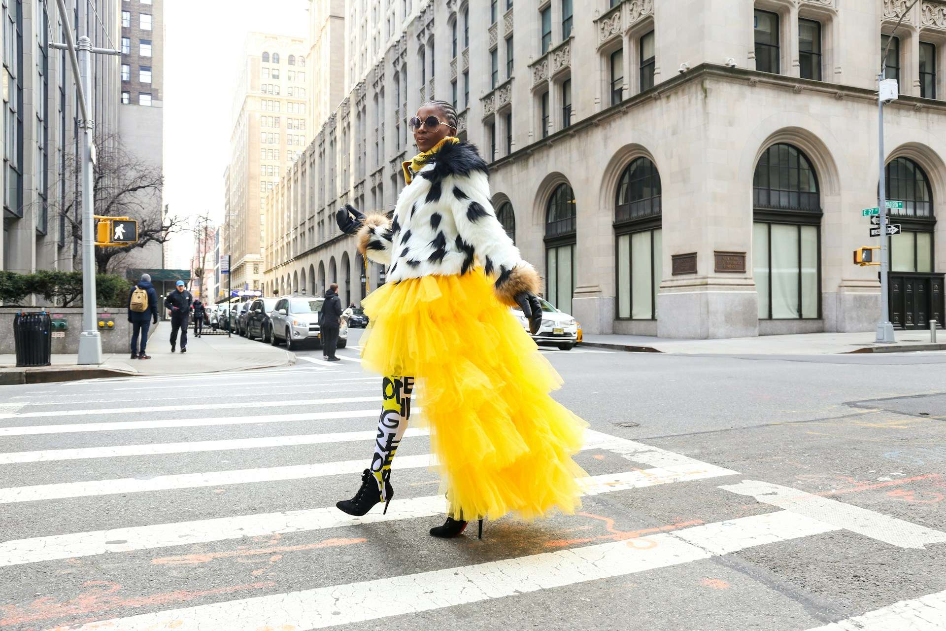 woman standing out in the street with fashion